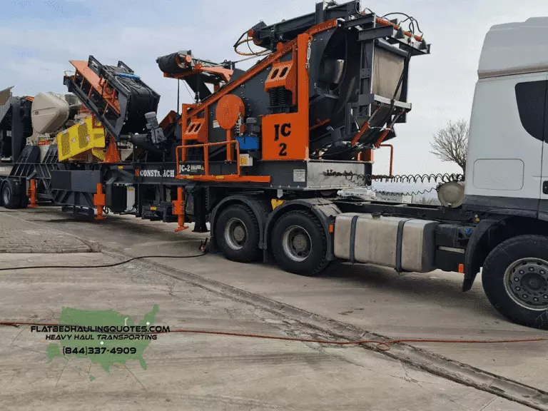 moving crushers on a flatbed trailer