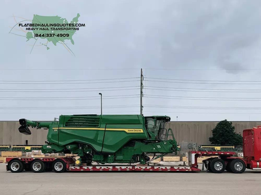 moving farm machinery on a flatbed trailer